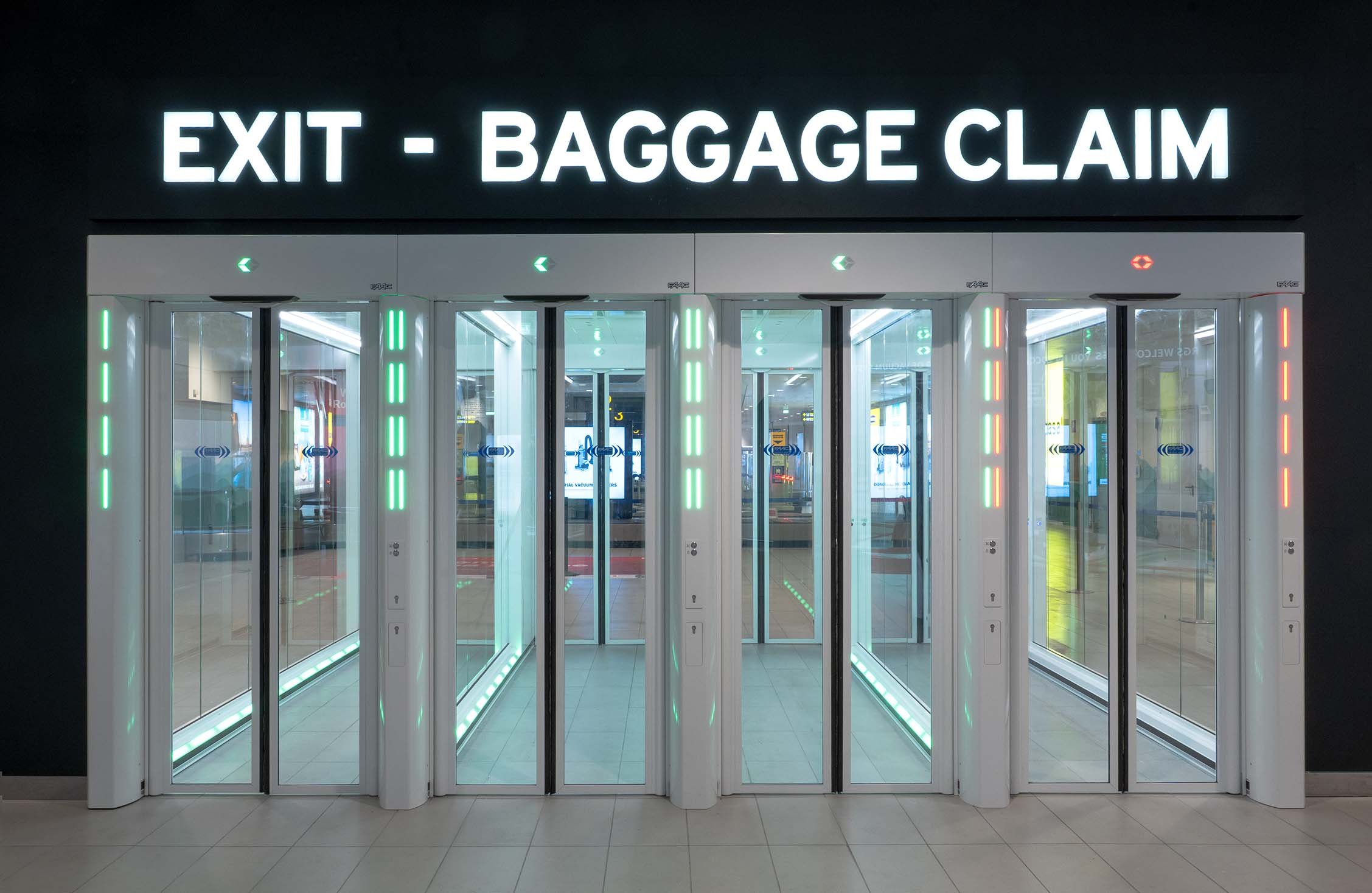 Four FAAC One-Way Corridors with LED signalling in the Schengen Arrivals hall at Bologna Airport